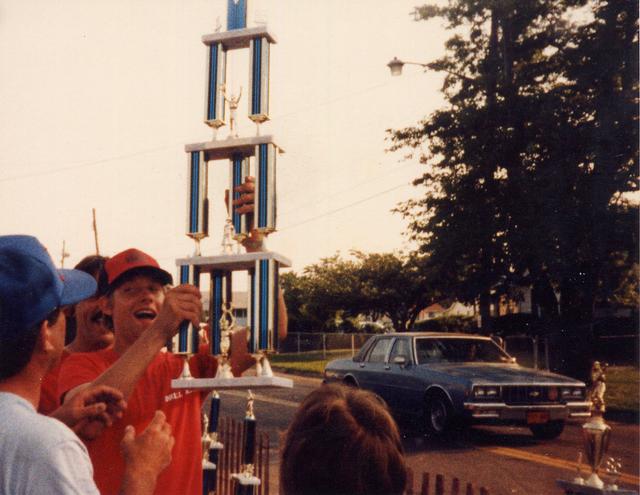 Team Captain Larry Behr Hoisting the Championship trophy